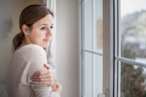 Woman Looking Out of Windows in Morton, IL