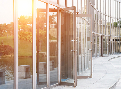 A glass facility with new Commercial Doors in Pekin IL