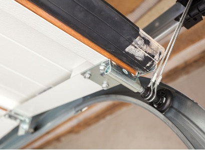 Work done to the track of a garage door done by Garage Door Companies in Peoria IL